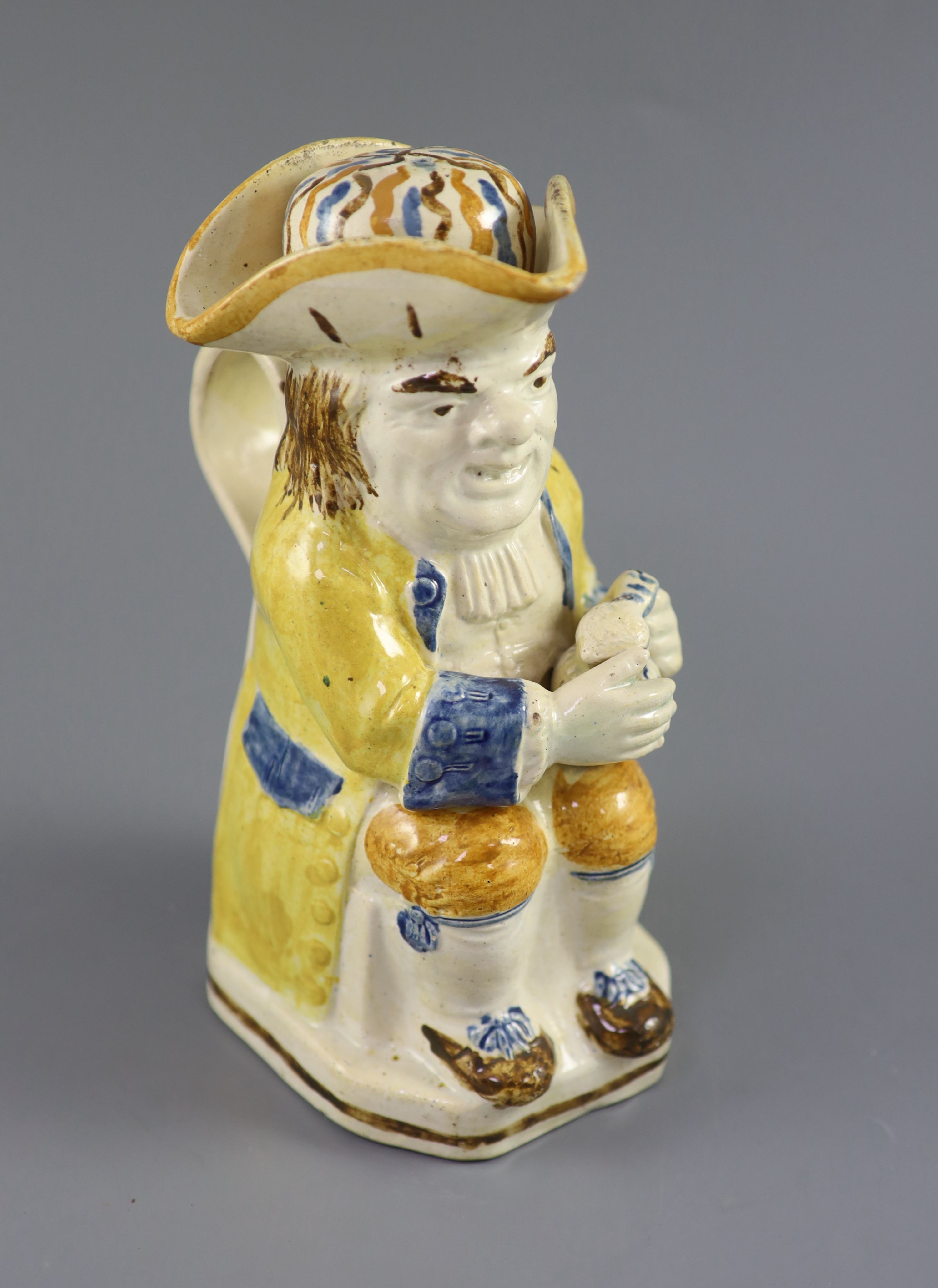 A Staffordshire Prattware Good Hearty Fellow Toby jug with rare hat measure, c.1790-1800, 25cm high